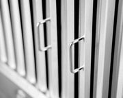 Macro close-up shot of the high-density stainless steel baffle filters with commercial-grade construction and polished handles.
