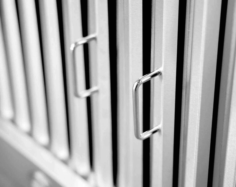 Macro close-up shot of the high-density stainless steel baffle filters with commercial-grade construction and polished handles.