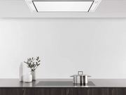 Kitchen view showing the White 900 CFM Flush Ceiling Mount Range Hood seamlessly installed in a white ceiling above an induction cooktop