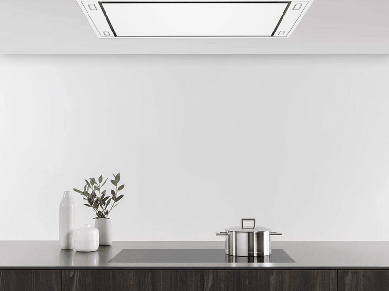 Kitchen view showing the White 900 CFM Flush Ceiling Mount Range Hood seamlessly installed in a white ceiling above an induction cooktop