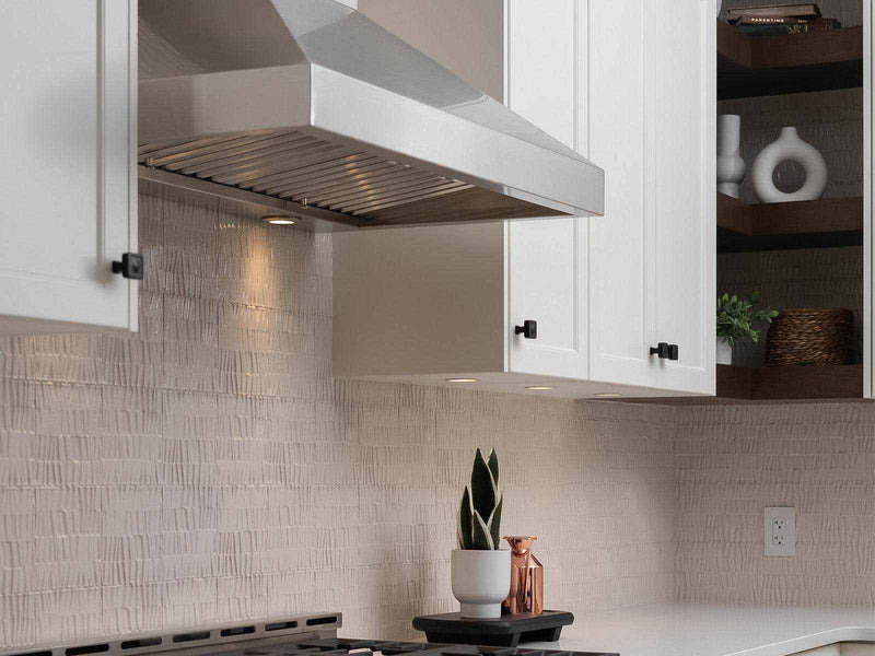 42 inch 750 CFM Wall Mount Range Hood installed in a modern kitchen with white cabinetry and integrated LED lighting